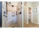 Large walk-in shower with tile surround and seat at 36080 W Merced St, Maricopa, AZ 85138