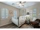 Bedroom with a queen-size bed and wood flooring at 36080 W Merced St, Maricopa, AZ 85138