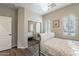 Bedroom with a queen-size bed and mirrored closet at 36080 W Merced St, Maricopa, AZ 85138