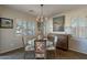 Elegant dining area with a glass-top table and cowhide print chairs at 36080 W Merced St, Maricopa, AZ 85138