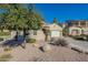 House exterior showcasing a tree and desert landscaping at 36080 W Merced St, Maricopa, AZ 85138