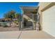 Landscaped front yard with a gate and a statue at 36080 W Merced St, Maricopa, AZ 85138