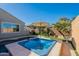 Enjoy a relaxing soak in this hot tub, nestled in a tranquil backyard setting at 36080 W Merced St, Maricopa, AZ 85138