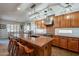 Modern kitchen with large island and stainless steel appliances at 36080 W Merced St, Maricopa, AZ 85138