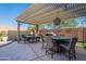 Enjoy dining al fresco in this beautiful patio setting, complete with pergola at 36080 W Merced St, Maricopa, AZ 85138