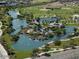 Aerial view of a community park with ponds, playground, and open green spaces at 42405 N Anthem Creek Dr, Anthem, AZ 85086