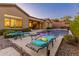 Luxury pool and patio with lounge chairs at 42405 N Anthem Creek Dr, Anthem, AZ 85086