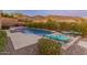 Inviting backyard pool with lounge chairs, mountain views at 42405 N Anthem Creek Dr, Anthem, AZ 85086