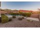 Landscaped backyard oasis with pool and mountain views at 42405 N Anthem Creek Dr, Anthem, AZ 85086