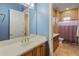 Clean bathroom with updated vanity, tile floor, and a shower/tub combo at 42405 N Anthem Creek Dr, Anthem, AZ 85086