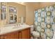 Clean bathroom with shower/tub combo and wood vanity at 42405 N Anthem Creek Dr, Anthem, AZ 85086