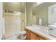 Clean bathroom with a shower, toilet, and vanity with wood cabinets at 42405 N Anthem Creek Dr, Anthem, AZ 85086