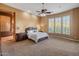 Spacious primary bedroom with plush carpet and ensuite bathroom at 42405 N Anthem Creek Dr, Anthem, AZ 85086