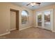 Well-lit bedroom with french doors leading to the backyard at 42405 N Anthem Creek Dr, Anthem, AZ 85086