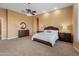 Large main bedroom with ample space and rich wood furnishings at 42405 N Anthem Creek Dr, Anthem, AZ 85086