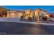 Beautiful home exterior, well-lit at night at 42405 N Anthem Creek Dr, Anthem, AZ 85086