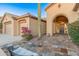 Charming front courtyard with stone pathway at 42405 N Anthem Creek Dr, Anthem, AZ 85086