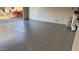 Bright garage with epoxy floor and storage at 42405 N Anthem Creek Dr, Anthem, AZ 85086