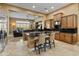 Open kitchen with large island, breakfast bar, and views at 42405 N Anthem Creek Dr, Anthem, AZ 85086