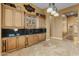 Butlers pantry with glass-front cabinets and granite countertops at 42405 N Anthem Creek Dr, Anthem, AZ 85086