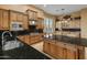 Bright kitchen with double sinks, granite countertops, and wood cabinets at 42405 N Anthem Creek Dr, Anthem, AZ 85086