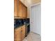 Butler's pantry with wine cooler and additional storage at 42405 N Anthem Creek Dr, Anthem, AZ 85086