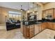 Kitchen boasts an island, stainless steel appliances, and granite counters at 42405 N Anthem Creek Dr, Anthem, AZ 85086