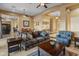 Comfortable living room with dark brown couch and end tables at 42405 N Anthem Creek Dr, Anthem, AZ 85086