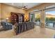 Living area with sliding doors opening to the pool area at 42405 N Anthem Creek Dr, Anthem, AZ 85086