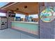 Outdoor snack bar with TVs and a variety of drinks at 42405 N Anthem Creek Dr, Anthem, AZ 85086