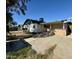 Backyard view of home with patio and stone bar at 4415 W Palo Verde Ave, Glendale, AZ 85302