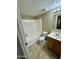 Clean bathroom with tub, toilet, and updated vanity at 4415 W Palo Verde Ave, Glendale, AZ 85302