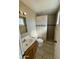 Clean bathroom with tile shower and single vanity at 4415 W Palo Verde Ave, Glendale, AZ 85302