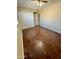 Spacious bedroom featuring wood-look floors and double closet at 4415 W Palo Verde Ave, Glendale, AZ 85302