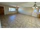 Spacious living room with tile flooring and ceiling fan at 4415 W Palo Verde Ave, Glendale, AZ 85302