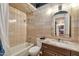 Updated bathroom with granite countertop and tile shower/tub at 4750 N Central Ave # A3, Phoenix, AZ 85012