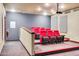 Community theater with red seating and a projector at 4750 N Central Ave # A3, Phoenix, AZ 85012