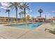 Refreshing pool with surrounding lounge chairs and palm trees at 4750 N Central Ave # A3, Phoenix, AZ 85012