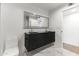 Modern bathroom with double vanity, sleek fixtures, and marble flooring at 4825 N 72Nd Way, Scottsdale, AZ 85251