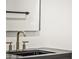 Close up on bathroom featuring a black vanity, modern fixtures, and a minimalist design at 4825 N 72Nd Way, Scottsdale, AZ 85251