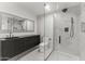 Modern bathroom featuring a sleek vanity, glass shower, and marble-look flooring at 4825 N 72Nd Way, Scottsdale, AZ 85251