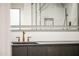 Modern vanity with matte black cabinets and gold hardware at 4825 N 72Nd Way, Scottsdale, AZ 85251