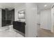 Bathroom featuring a glass shower, sleek vanity, and marble-look flooring at 4825 N 72Nd Way, Scottsdale, AZ 85251