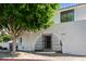 White stucco home with arched entry gate at 4825 N 72Nd Way, Scottsdale, AZ 85251