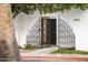 Detailed wrought iron gate secures the entry to the home at 4825 N 72Nd Way, Scottsdale, AZ 85251