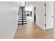 Light hallway with modern floating staircase at 4825 N 72Nd Way, Scottsdale, AZ 85251