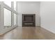 Bright living room with a modern fireplace, large windows, and light wood flooring at 4825 N 72Nd Way, Scottsdale, AZ 85251