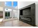 Bright living room with a modern fireplace and large windows at 4825 N 72Nd Way, Scottsdale, AZ 85251