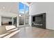 Bright living room with a modern fireplace and large windows at 4825 N 72Nd Way, Scottsdale, AZ 85251