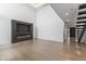 Spacious living room featuring a modern fireplace, high ceilings, and light wood flooring at 4825 N 72Nd Way, Scottsdale, AZ 85251